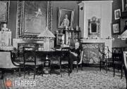 In the Red Living Room. Nikolai Von Meck at the table. 1902