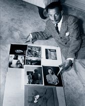 © Wirephoto A.P. Salvador Dali showing some reproductions of his work, 1946